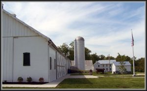 side view of barn with silo